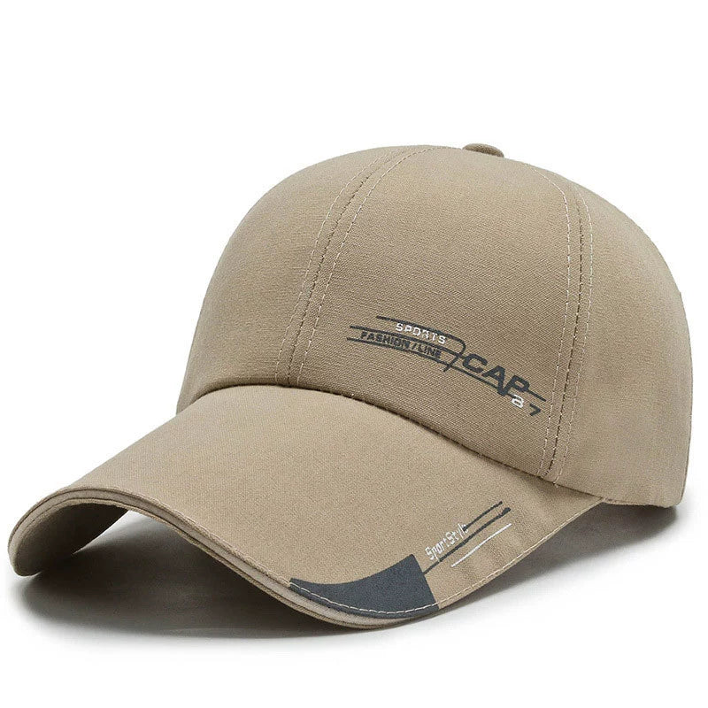 Beige sports baseball cap with curved brim and printed text design, casual hat