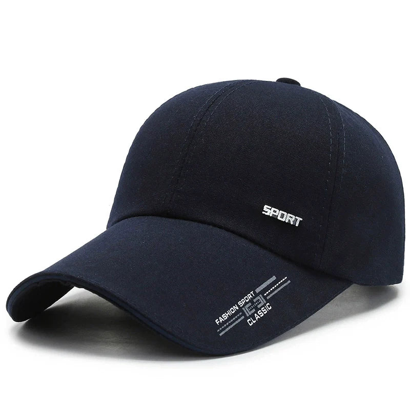 Navy blue baseball cap with 'SPORT' and 'FASHION SPORT CLASSIC' text, curved brim