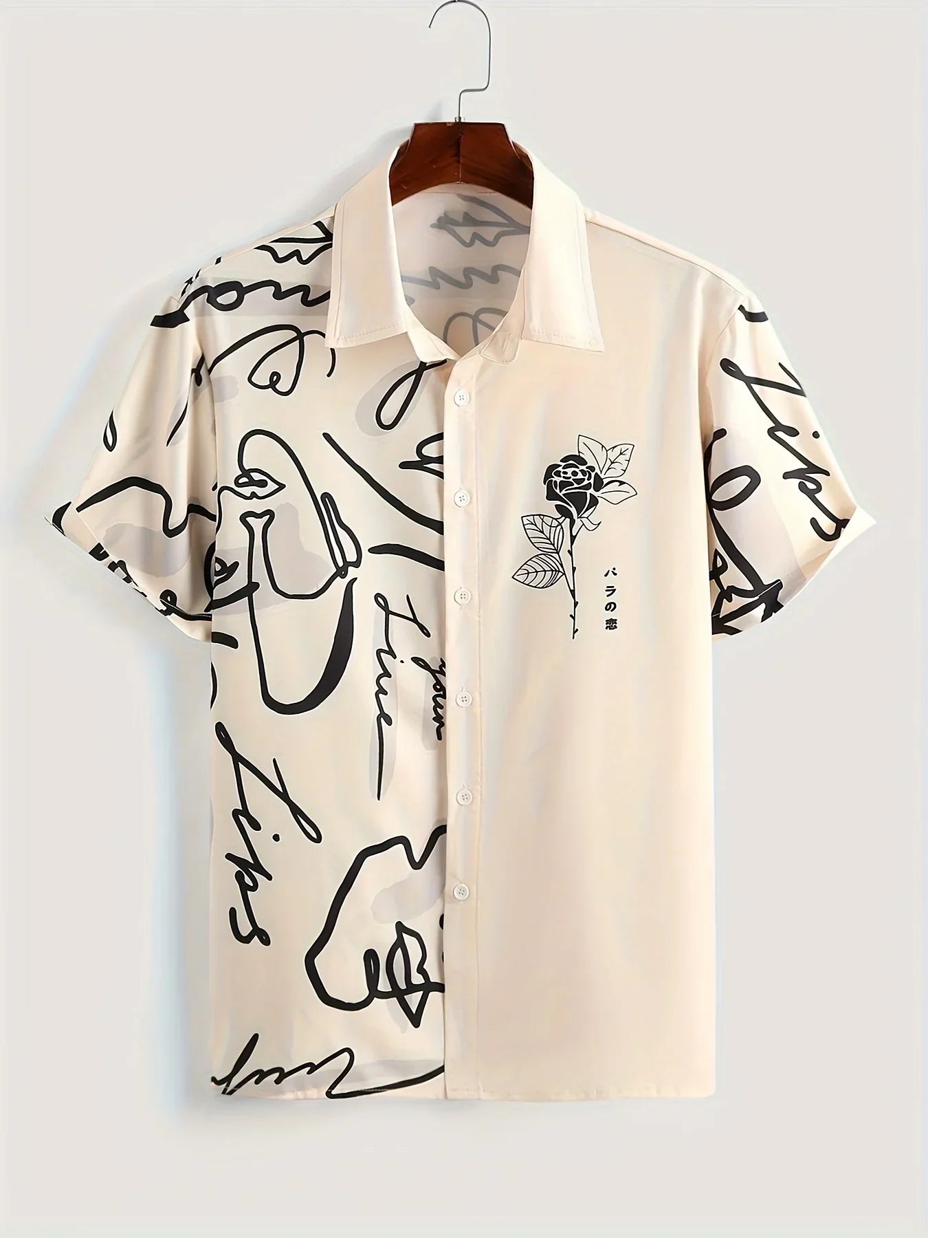Beige short sleeve button-up shirt with abstract black line art and floral print design.