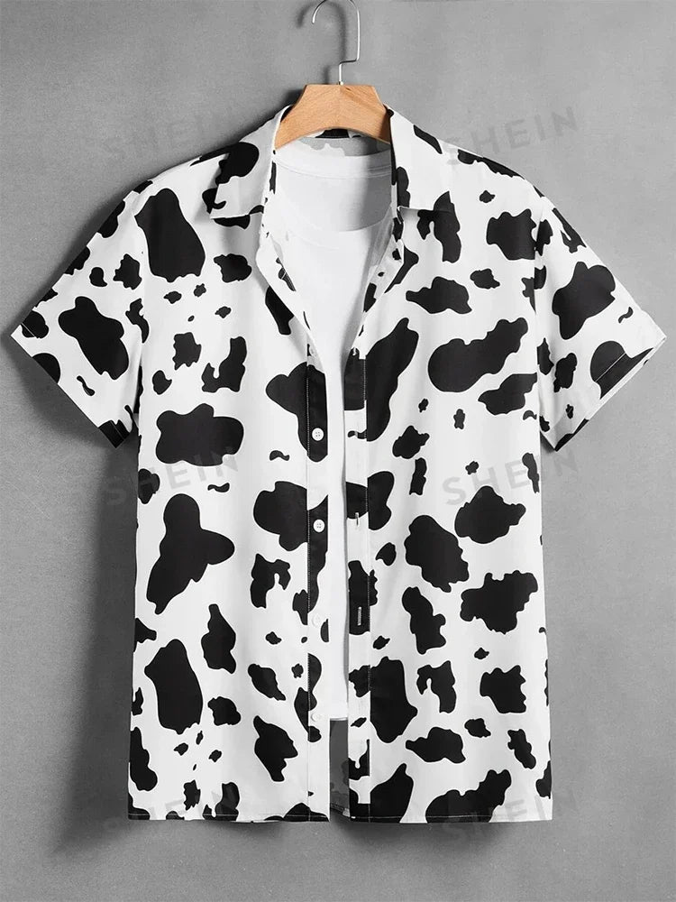 Short-sleeve button-up shirt with black and white cow print pattern on hanger