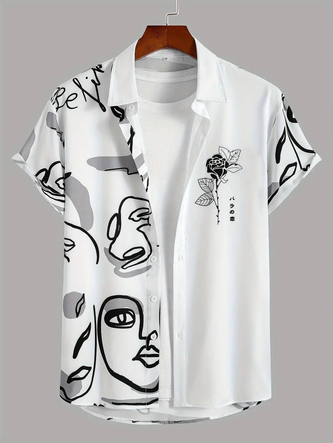 White short sleeve button-up shirt with abstract face print and rose graphic, modern casual style