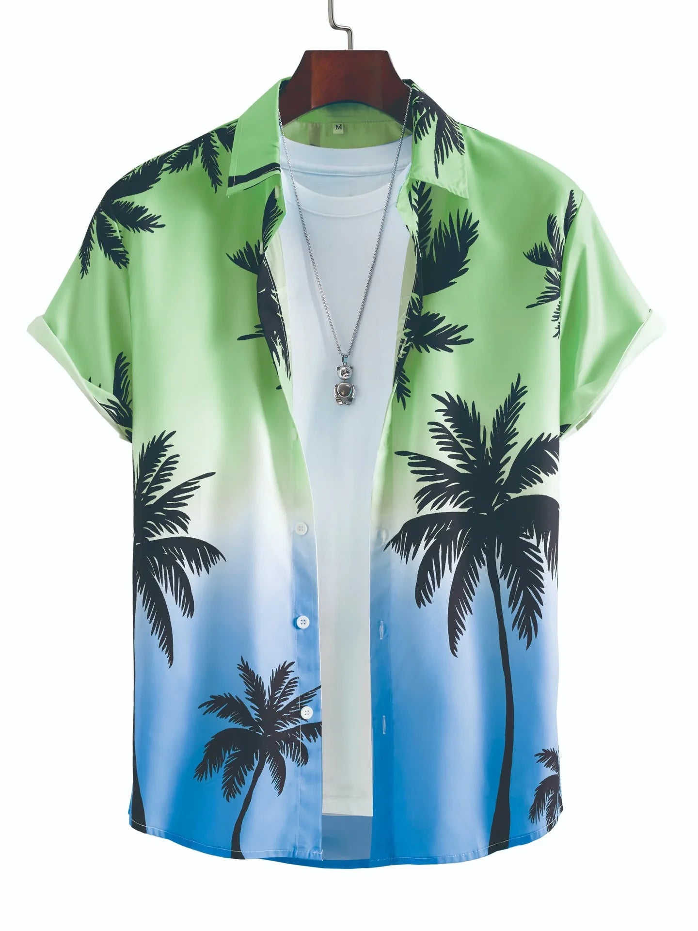 Green and blue ombre palm tree print Hawaiian shirt with white t-shirt and pendant.