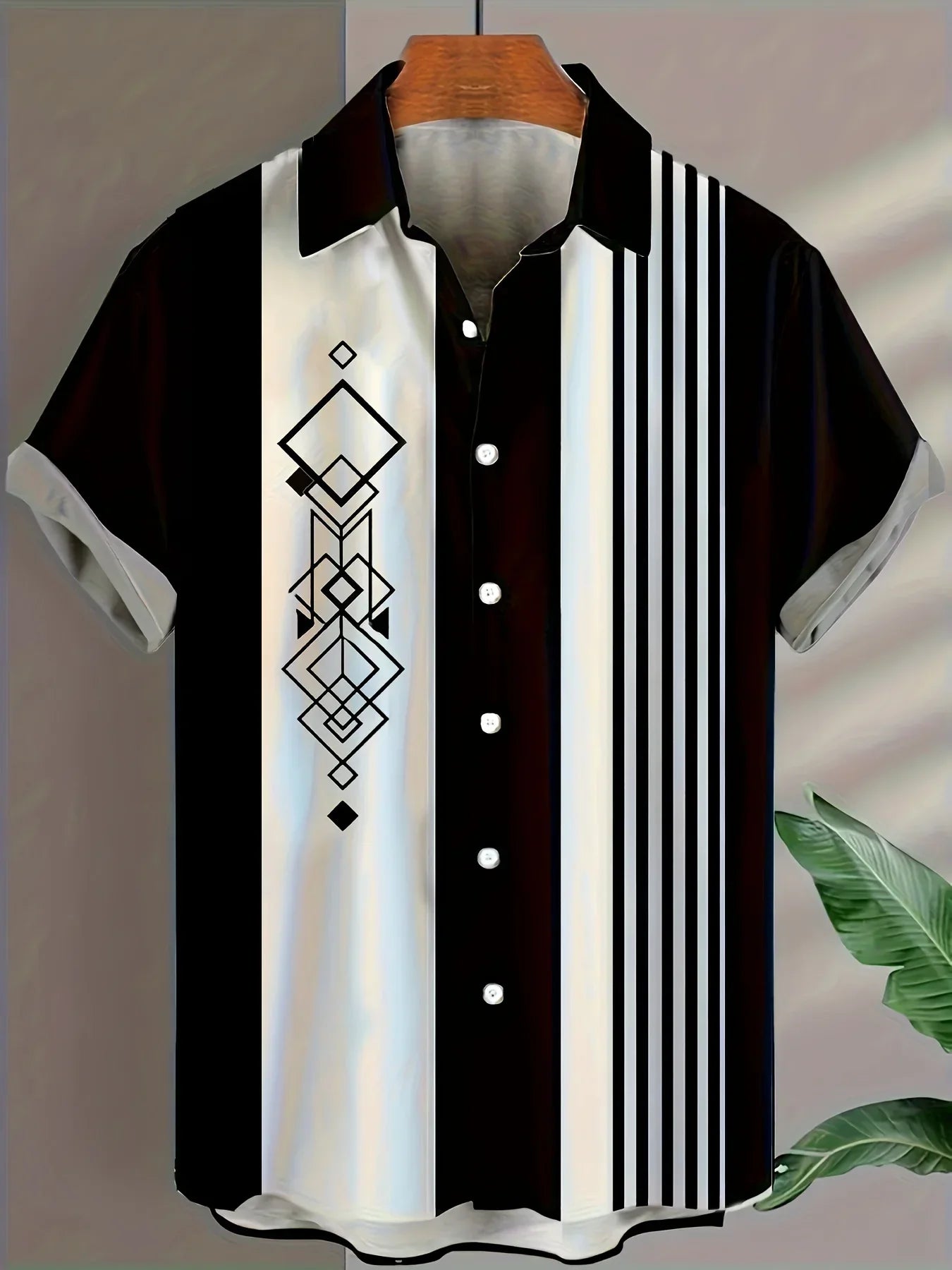 Short sleeve black and white button-up shirt with geometric diamond and stripe pattern