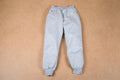 Children's grey sweatpants with elastic cuffs on a neutral background